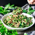 spoonful of green beans with bacon and mushrooms
