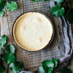 baked pastry shell on a wire cooling rack