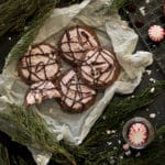 Chocolate Peppermint Cookies: a chocolate cookie topped with fluffy peppermint icing, crushed peppermint, and a drizzle of chocolate. | www.savortheflavour.com