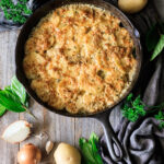 scalloped potatoes in a cast iron skillet