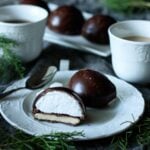 chocolate teacake on a plate with a teacup