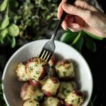 In this easy recipe for Buttery Garlic Parsley Potatoes, new red potatoes are boiled on the stovetop and tossed with brown butter, sautéed garlic, and fresh parsley to make the ultimate gluten free, comfort food side dish. | www.savortheflavour.com #poatotes #glutenfree #sidedish #parsley #comfortfood