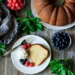 slice of sour cream pound cake on a white plate with fork