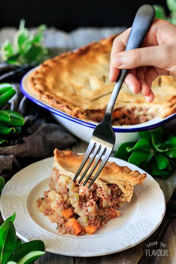 plate of corned beef pie with fork