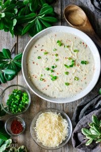 bowl of crab soup with toppings