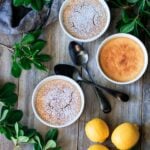 three lemon pudding cakes with fresh lemons