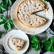 slice of blueberry frangipane tart on a plate