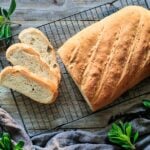 English bloomer loaf on cooling rack with slices