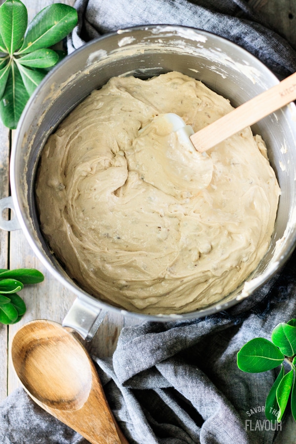 maple walnut bundt cake batter with walnuts folded in