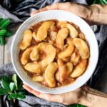 holding a bowl of fried apples