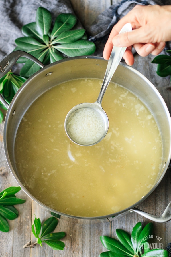 adding rice to Greek lemon chicken soup