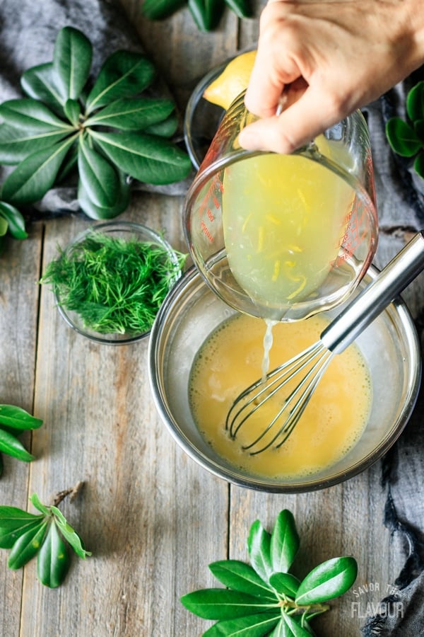 pouring lemon juice into eggs for Greek lemon chicken soup