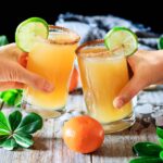 doing a toast with ginger beer mocktail with lime