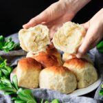 breaking one of the Hokkaido milk bread rolls in half