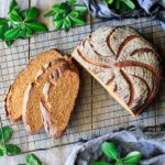 slices of whole wheat molasses bread with the loaf