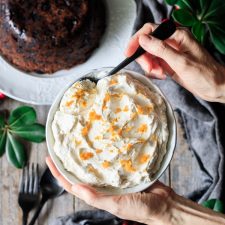 holding a bowl of brandy butter
