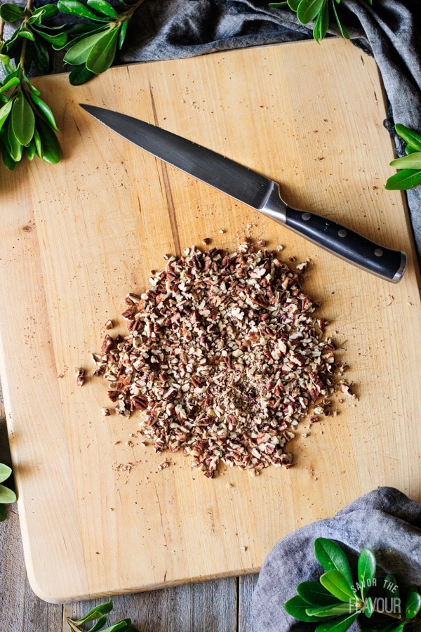 chopping the toasted pecans for Mexican wedding cookies
