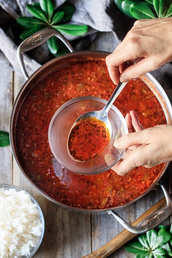 skimming the fat off of the stuffed pepper soup