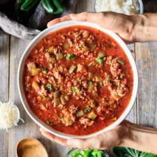 holding a bowl of stuffed pepper soup