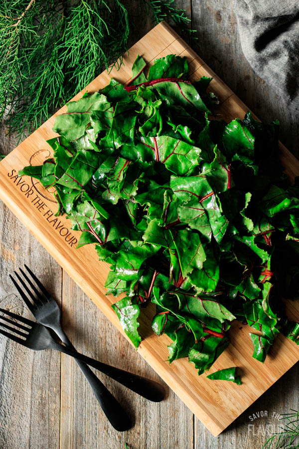 chopped beet greens on a cutting board