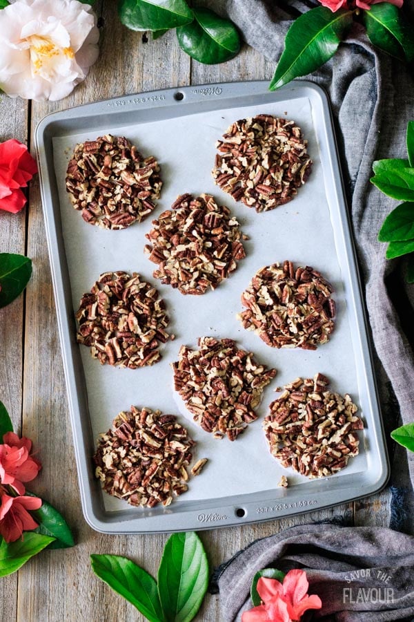 piles of toasted pecans for chocolate turtles