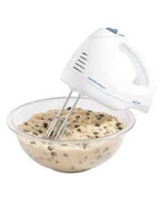electric hand mixer with a bowl of chocolate chip cookie dough