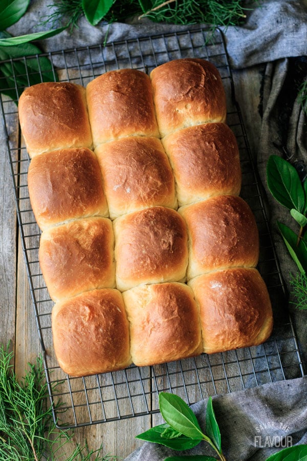 Hawaiian sweet rolls on a wire cooling rack