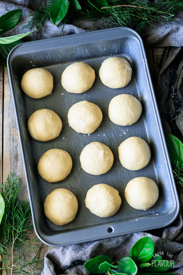 placing Hawaiian sweet rolls in the baking pan