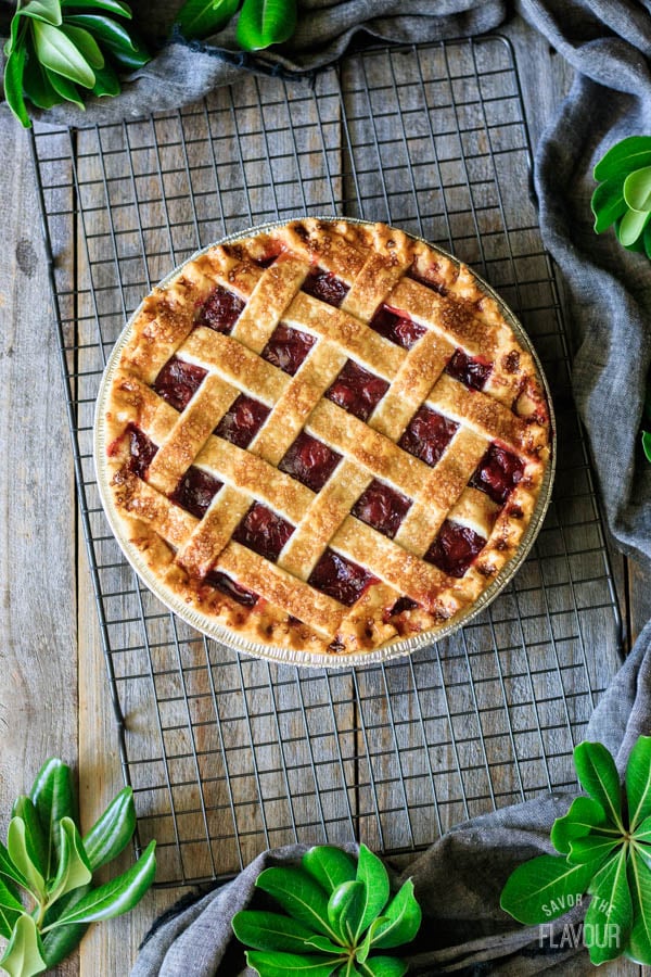 baked cherry pie on a wire cooling rack