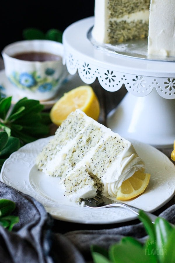 slice of lemon poppy seed cake with a fork