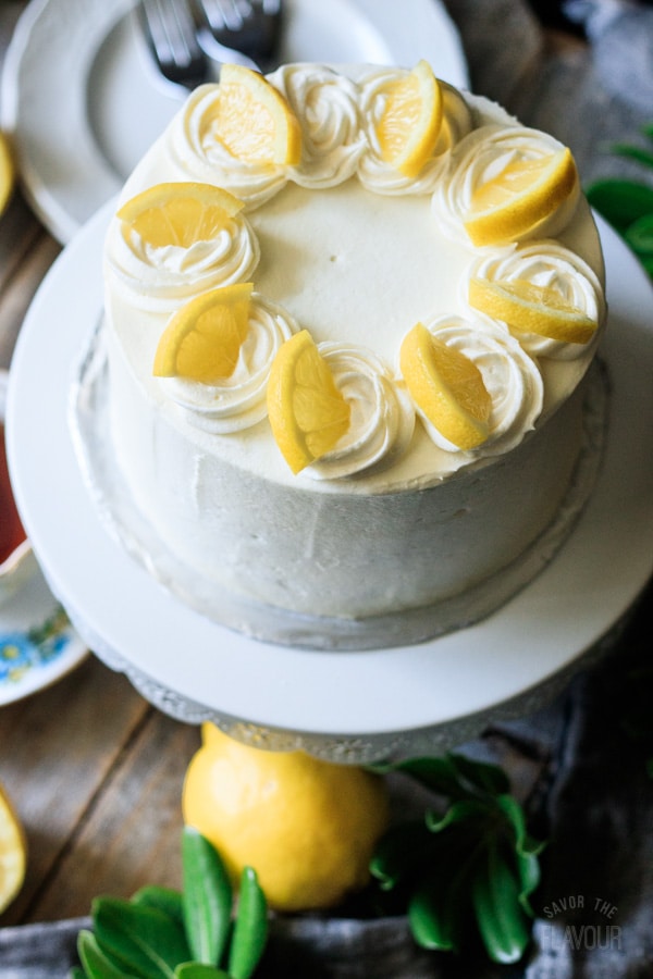 lemon poppy seed cake on a cake stand