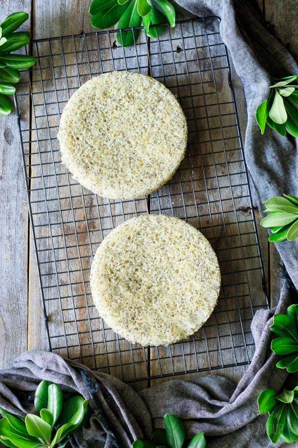 baked lemon poppy seed cakes on a cooling rack