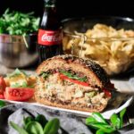 Sicilian tuna salad sandwich with chips and Coke