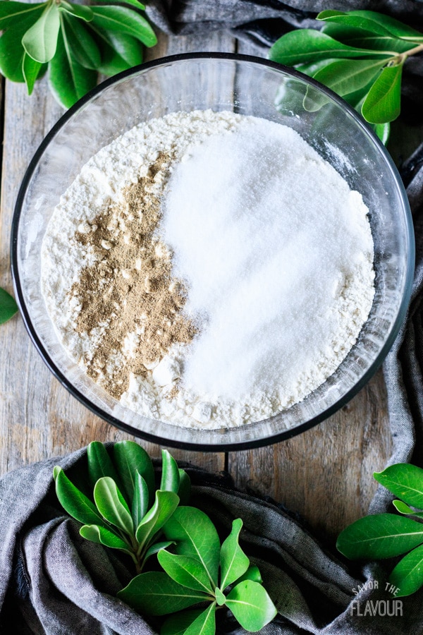 adding cardamom and sugar to flour mixture