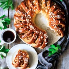 Swedish tea ring on a plate with a cup of tea