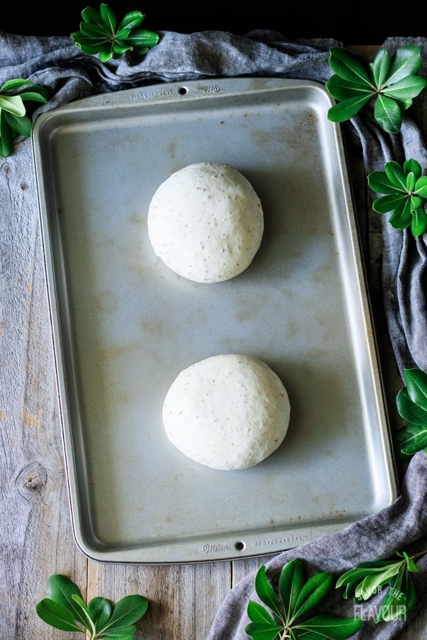 two loaves of rosemary bread before rising