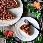 slice of pecan pie on a plate with a fork
