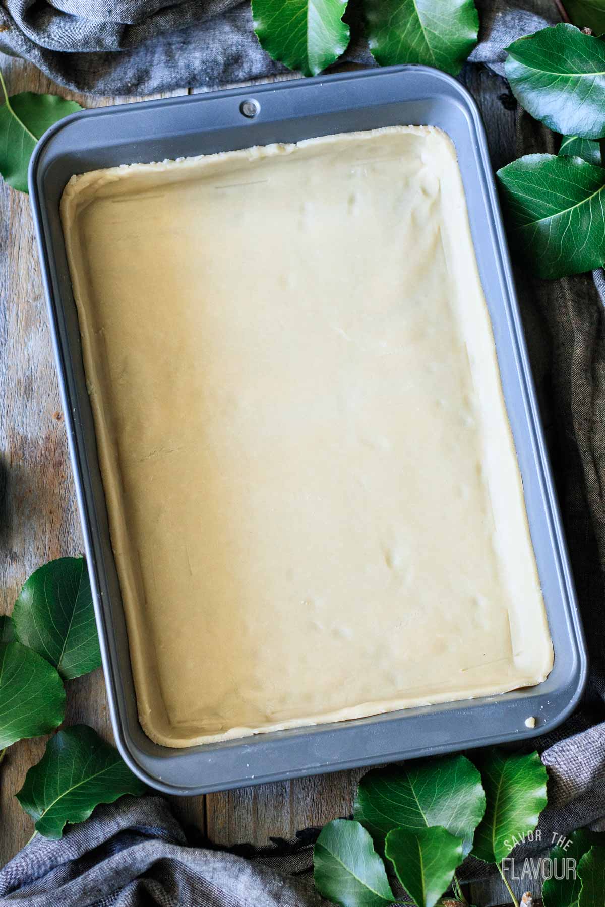 rectangular cake pan lined with pastry