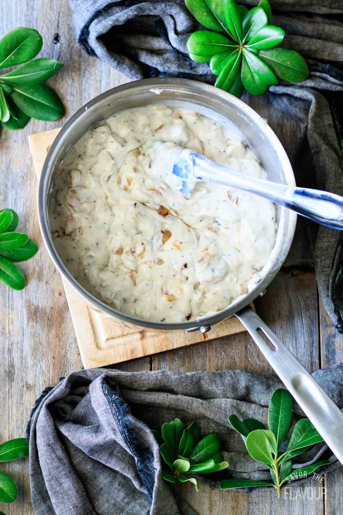 turkey gravy with onions in a saucepan