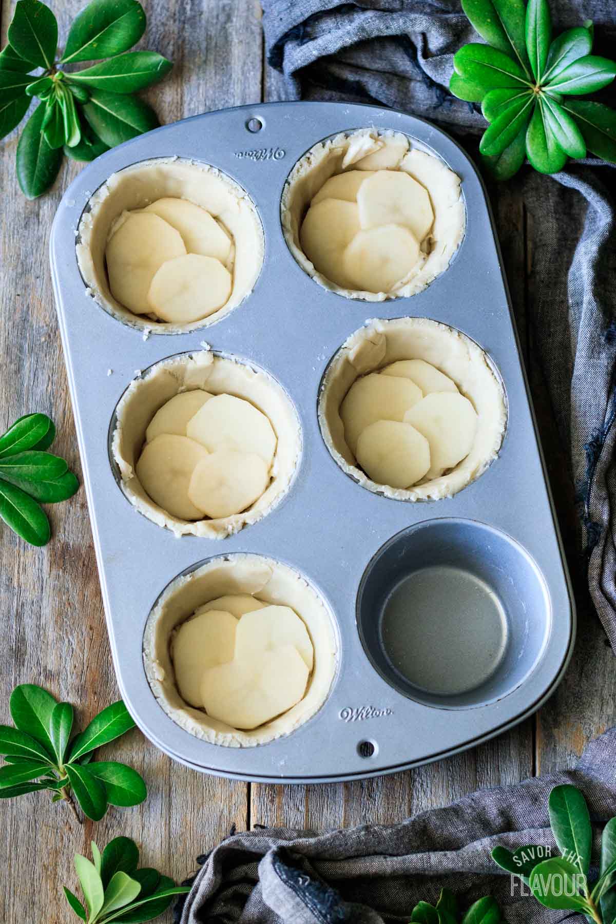 turkey cranberry pies with sliced potato layer