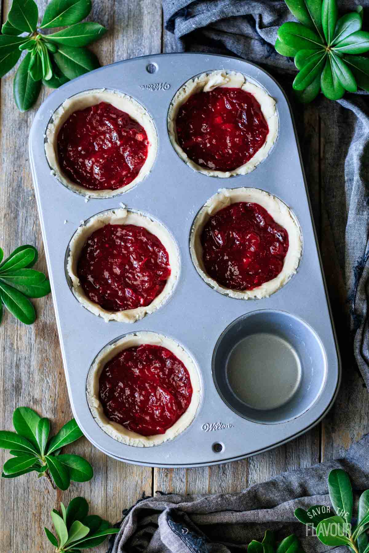 turkey cranberry pies with cranberry sauce layer