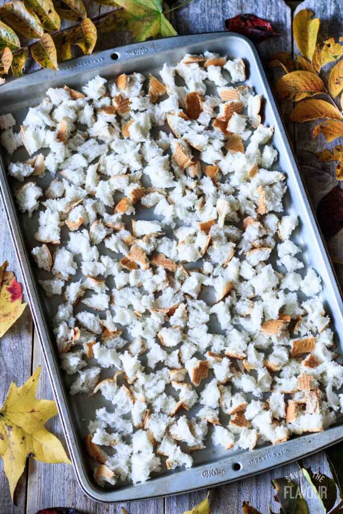 torn up bread pieces on a cookie sheet