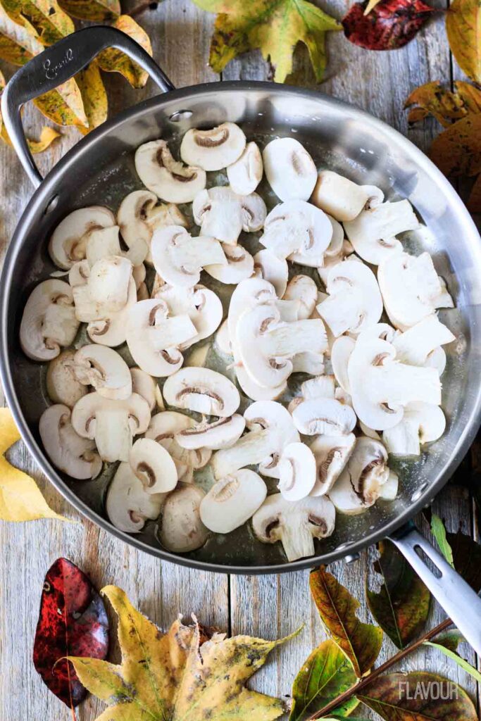 sliced mushrooms in a skillet