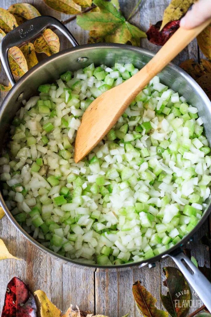 frying celery and onion in a skillet