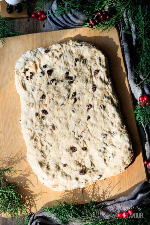 rolled out stollen dough on a cutting board
