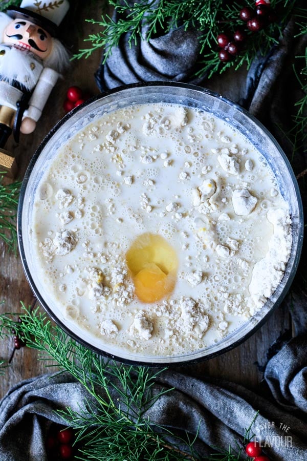 adding milk and egg to flour mixture