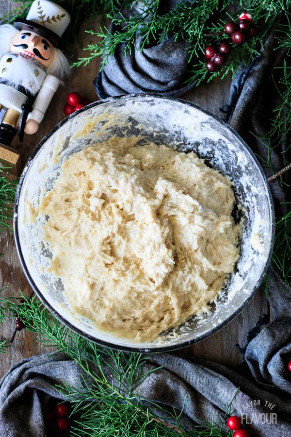 sticky stollen dough in a glass bowl