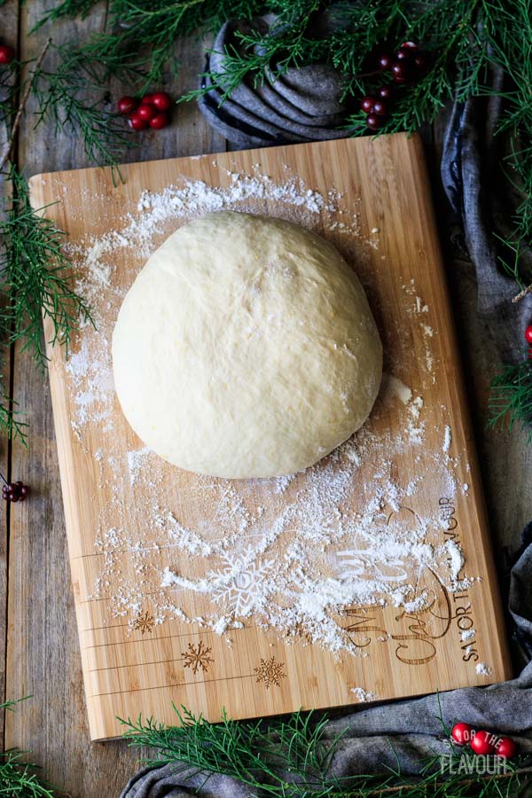 kneaded stollen dough on a cutting board