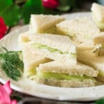 stack of cucumber sandwiches on a plate