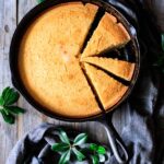 wedges of cornbread in a cast iron skillet